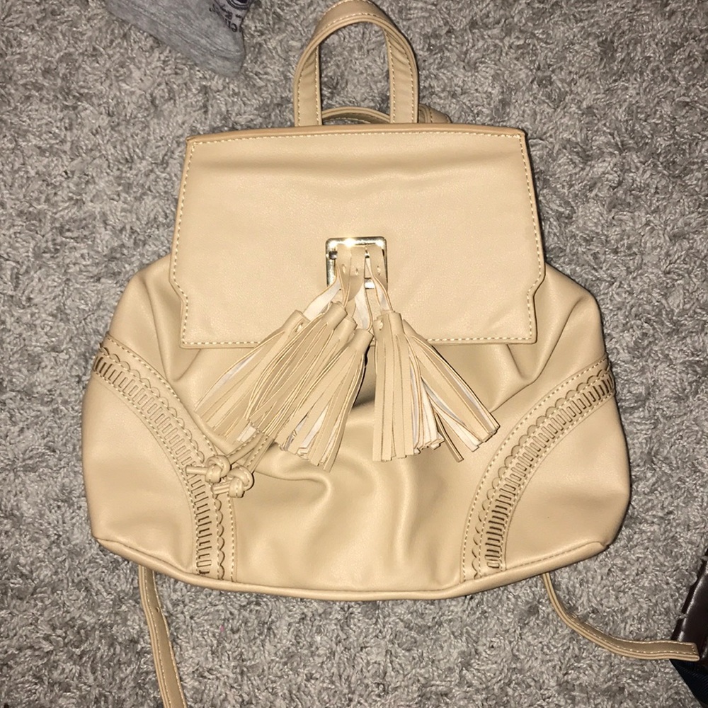 Beige book bag with tassels